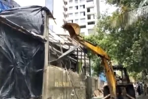 X/ANI : Mumbai: Illegal portion of the bar in Juhu where Worli hit and run case accused went before the accident, is being demolished by BMC.
